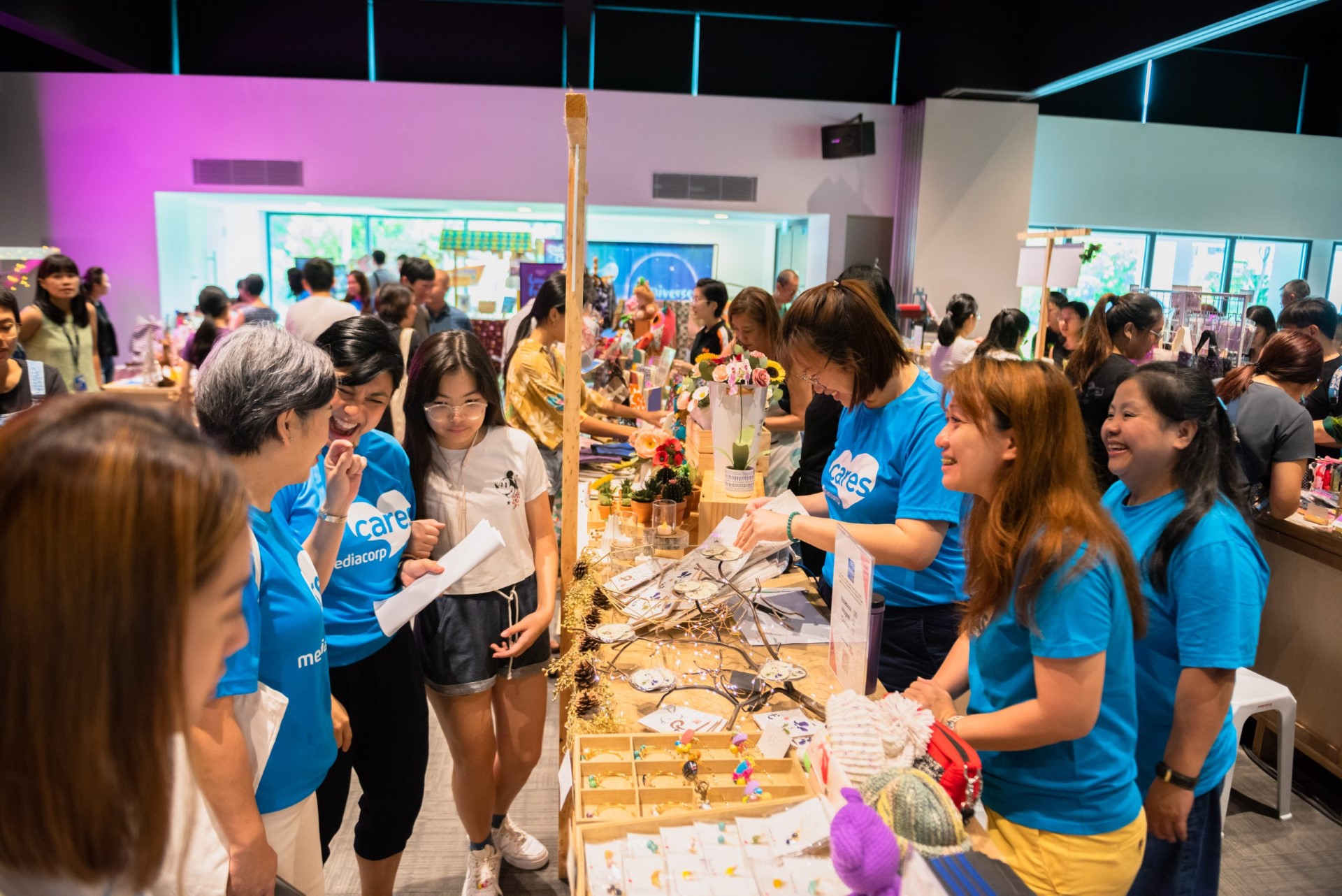 Picture shows a bustling scene of shoppers at the Gift Market in Enabling Village in 2019.