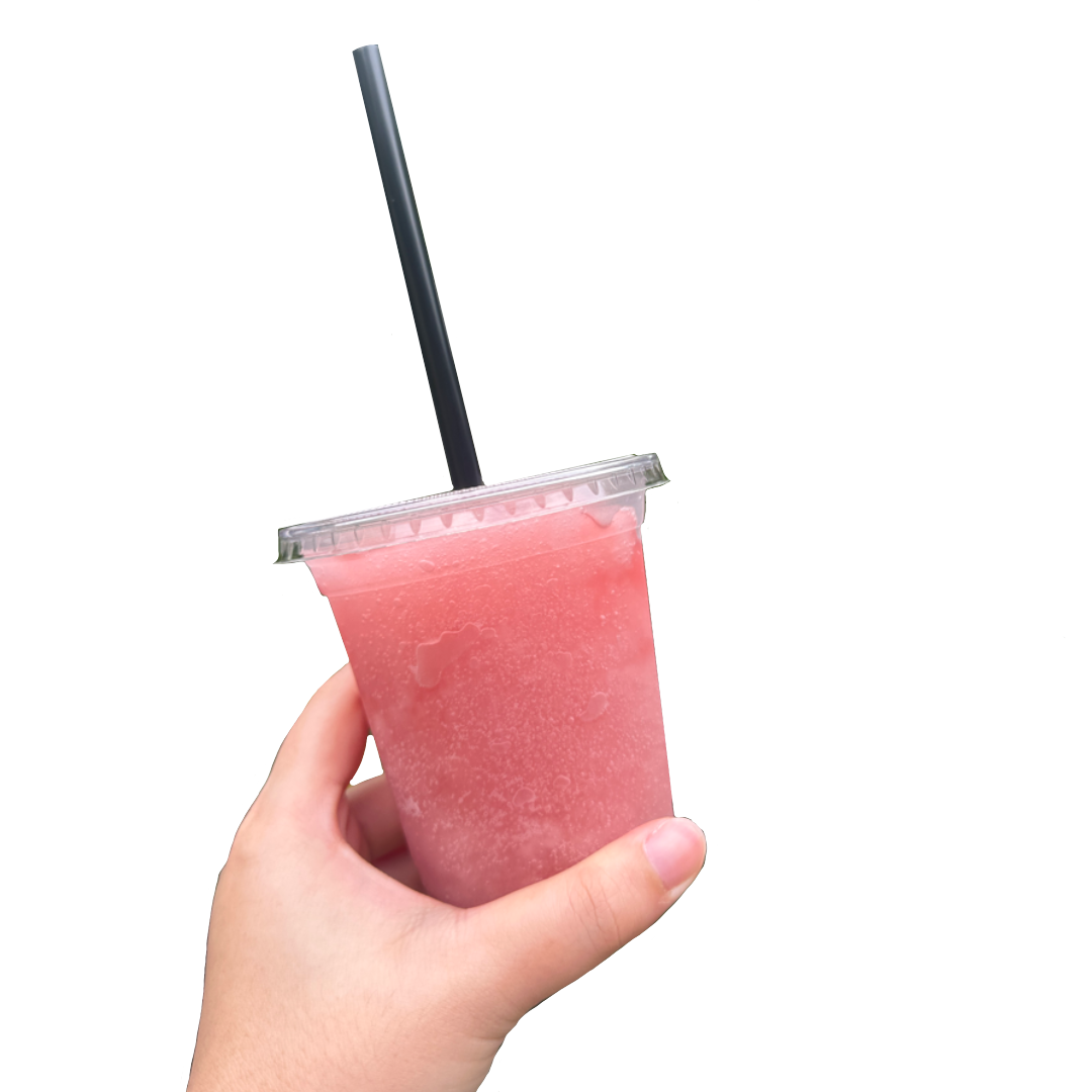 A cup of Ribena freeze with a straw being held in a hand.